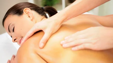 Brunette Client Receiving Body Massage at Spa Club Stock Footage