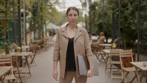 Brunette Freelancer Dressed in a Suit Working with Laptop Outdoors Stock Footage 285130042
