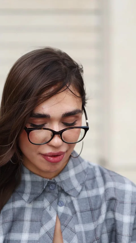 Brunette in glasses puts on clear aligners Stock Footage 314711549