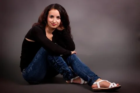Brunette on a gray background Stock Photos