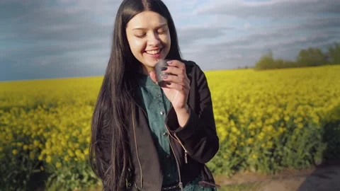 The brunette laughs and drinks tea. Stock Footage 131550031