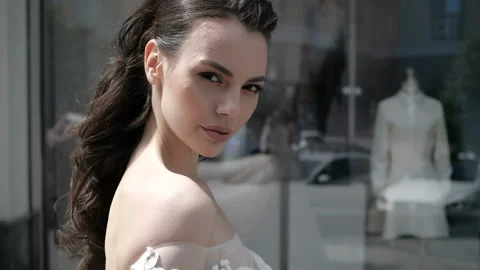 Brunette is looking at camera 스톡 동영상 92022332