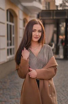 A brunette is looking into the camera Stock Photos