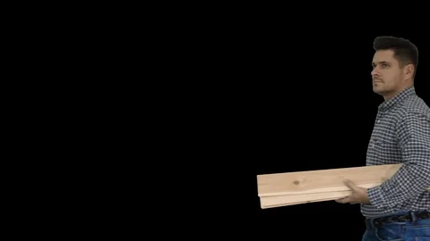 Brunette man builder with planks is ready to build something, Alpha Channel Stock Footage 109060942