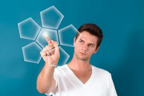 Brunette man pressing virtual button Foto stock