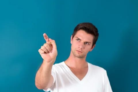 Brunette man pressing virtual button Stock Photos
