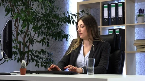 Brunette manager works in the office with documents 動画素材 108542048