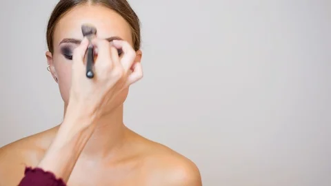 Brunette model getting makeup. Stock Footage 96299970