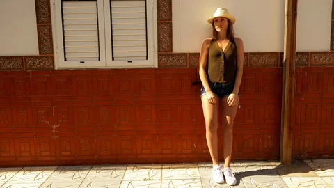 Brunette model leaning on the wall Video stock 107012871