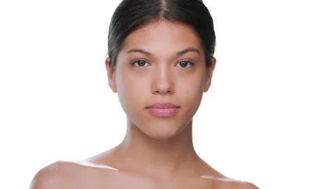 Brunette model opens eyes looks at camera healthy skin Stock Footage 339399875
