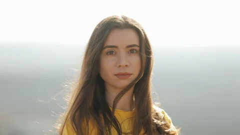 Brunette model posing sunset sky background portrait Stock Footage 235528379