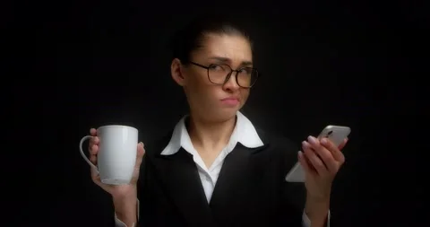 Brunette is not happy with the read message in the smartphone Stock Footage 194478107