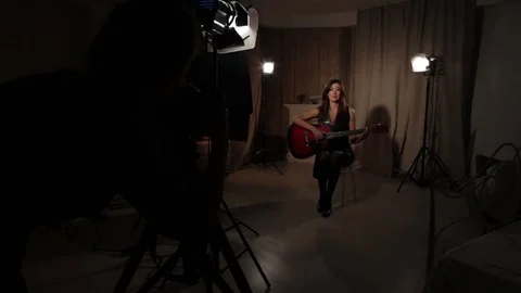 Brunette poses in studio. Video stock 69749360