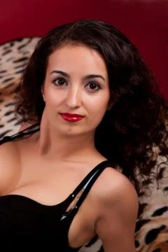 Brunette on a red background Stock Photos