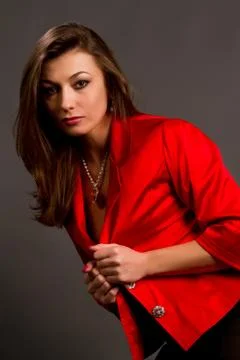 Brunette in a red jacket Stock Photos