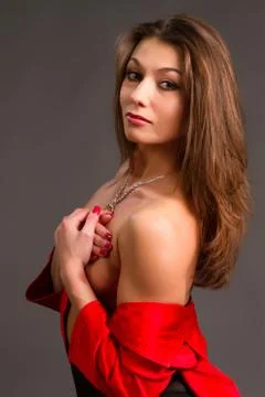Brunette in a red jacket Stock Photos