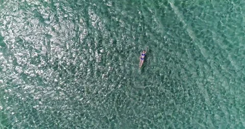 Brunette swims on her back Stock Footage 138933219