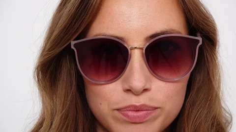 Brunette Taking Off Sunglasses Stock Footage 117440661