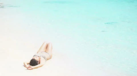 Brunette tanning in bikini Stock Footage 36869338