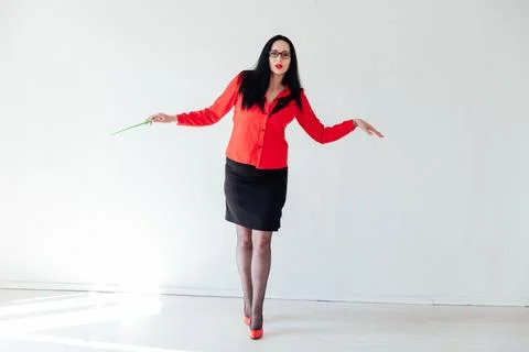 Brunette teacher in red blouse pointer stick Stock Photos