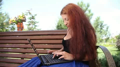 Brunette typing on a laptop. Video stock 11658758