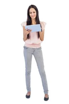 Brunette using tablet pc Foto stock