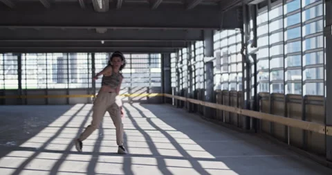 Brunette walking towards camera and dancing Stock Footage 213648642