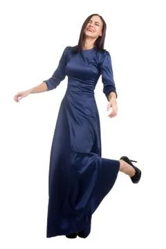 Brunette on white isolated background dancing in a long classic dress in blue 스톡 사진