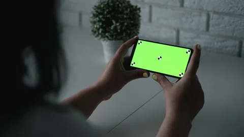 Brunette woman holding chroma key green screen smartphone. Stock Footage
