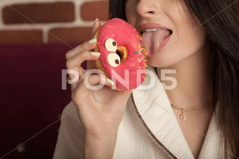 Brunette woman in white bathrobe Stock Photos