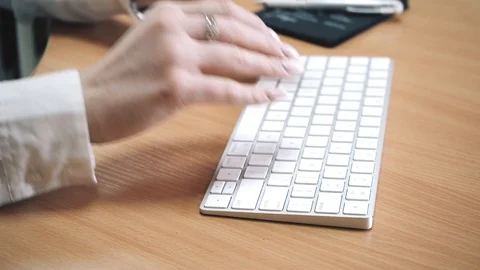 A brunette young lady is working at office Stock Footage 127323948