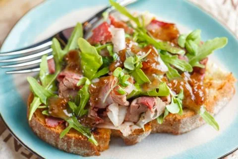 Bruschetta with beef, arugula Stock-Fotos