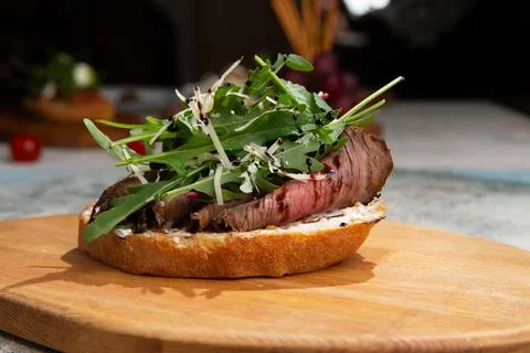 Bruschetta with beef, rucola and tomatoes Stock Photos