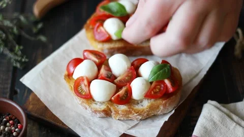 Bruschetta with mozzarella, tomatoes and basil. Vegetarian food. Healthy eating. Stock Footage 200094699