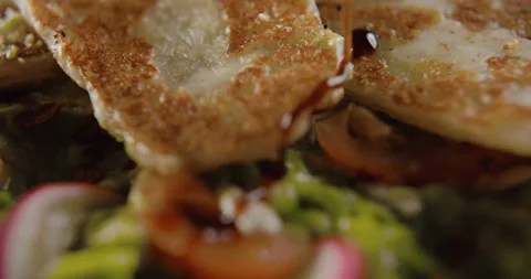 Bruschetta poured over sauce in slow motion in 4k Stock Footage 101372435