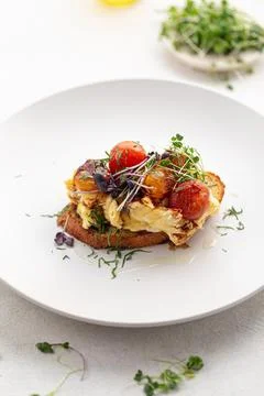 Bruschetta with scrambled egg and vegetables Stock Photos