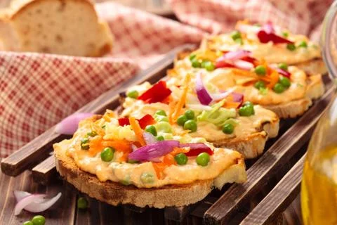 Bruschetta with spring vegetables. Stock Photos