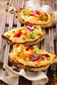 Bruschetta with spring vegetables. Stock Photos