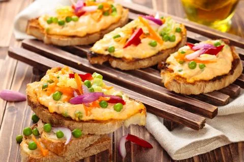 Bruschetta with spring vegetables. Stock Photos