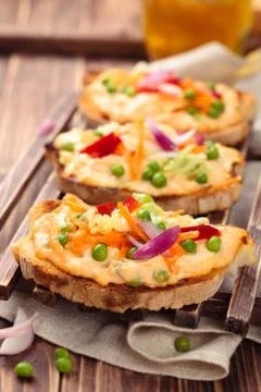 Bruschetta with spring vegetables. Stock Photos