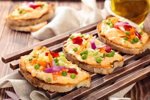 Bruschetta with spring vegetables. Stock Photos