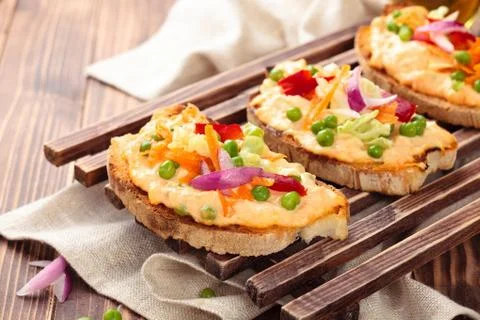 Bruschetta with spring vegetables. Stock Photos