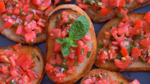 Bruschetta with tomatoes and basil close-up slow motion food Stock Footage 114077085