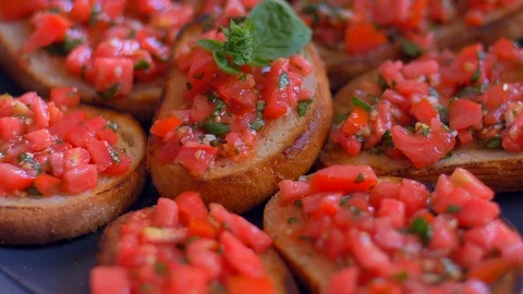 Bruschetta with tomatoes and basil close-up slow motion food Stock Footage 114078049