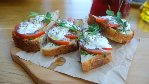 Bruschetta with tomatoes and cheese Video stock 241077498