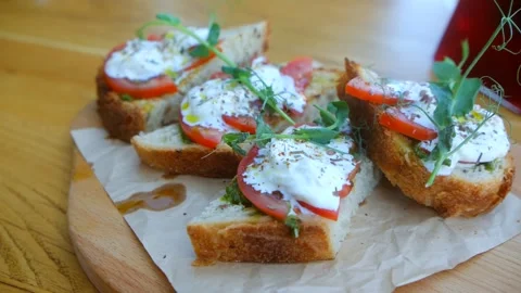 Bruschetta with tomatoes and cheese. Stock Footage 243187650