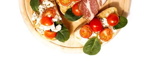 Bruschetta is usually served as snack or appetizer. Italian set on wooden board Stock Photos
