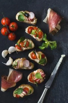 Bruschettas on the board Stock Photos