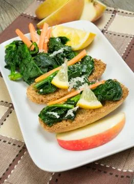 Bruschette spinach with lemon Stock Photos