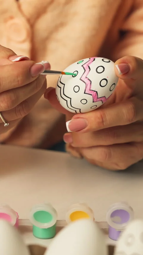 Brush Adding Zigzag Pattern to Easter Egg Stock Footage 328616156